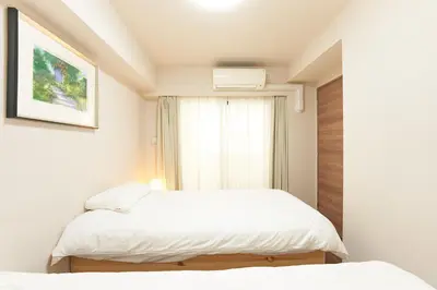 a bedroom with two beds and a window at HIZ HOTEL - Vacation STAY 18549v in Tokyo