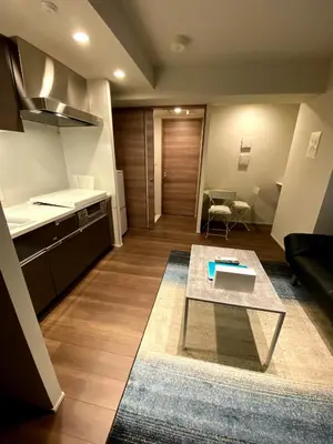 a living room with a table and a kitchen at HIZ HOTEL - Vacation STAY 18549v in Tokyo