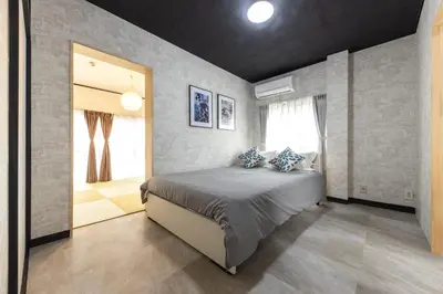 a bedroom with a large bed in a room at Urban Stay Oshiage in Tokyo