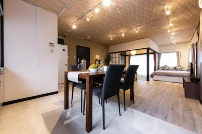 a dining room and living room with a table and chairs at Urban Stay Oshiage in Tokyo
