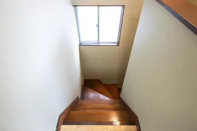 a staircase with a window in a house at Urban Stay Aoto in Tokyo