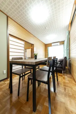 a dining room with a table and chairs at Urban Stay Aoto in Tokyo