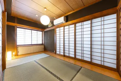 a room with large windows and a rug at Urban Stay Aoto in Tokyo