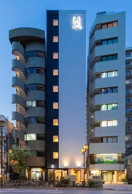 a tall building with a crown on top of it at Asta Hotel in Tokyo