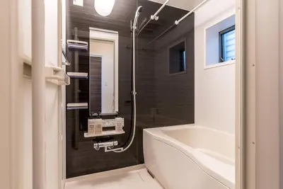 a bathroom with a tub and a sink and a toilet at T-BASE - Vacation STAY 21952v in Tokyo