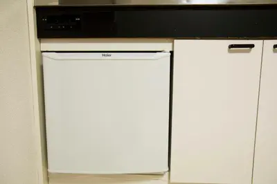 a white dishwasher with a microwave on top of it at Papa201 in Tokyo