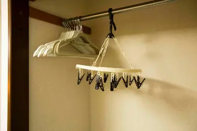 a light hanging from a pole in a bathroom at Papa201 in Tokyo
