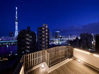 a view of a city skyline at night at Minn Asakusa in Tokyo