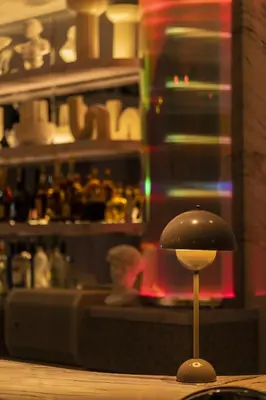 a black lamp sitting on top of a table at moire HOTEL YOSHIWARA in Tokyo
