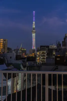 a view of the eiffel tower lit up at night at moire HOTEL YOSHIWARA in Tokyo