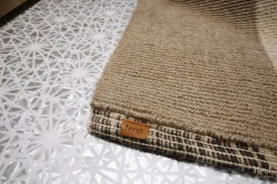 a close up of a rug sitting on a bed at Real Life SANGENJAYA in Tokyo
