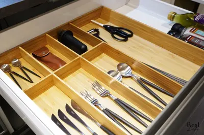 a drawer with silver utensils in a kitchen at Real Life SANGENJAYA in Tokyo