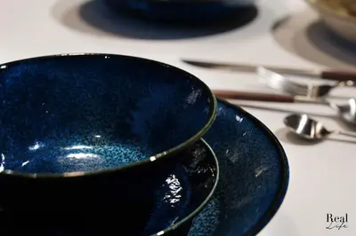 a blue bowl sitting on top of a table at Real Life SANGENJAYA in Tokyo