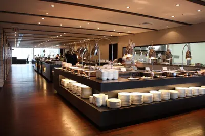a buffet line with plates on display in a restaurant at Tokyo Dome Hotel in Tokyo