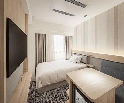 a hotel room with a bed and a table at R&B HOTEL UENO HIROKOJI - Vacation STAY 13873v in Tokyo