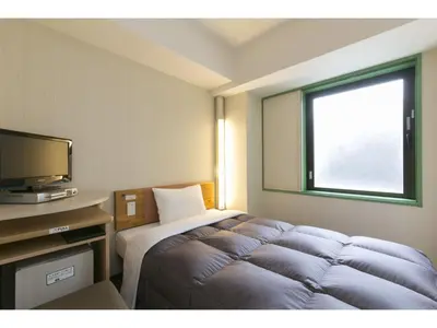 a hotel room with a bed and a television at R&B HOTEL HIGASHI NIHONBASHI - Vacation STAY 14012v in Tokyo