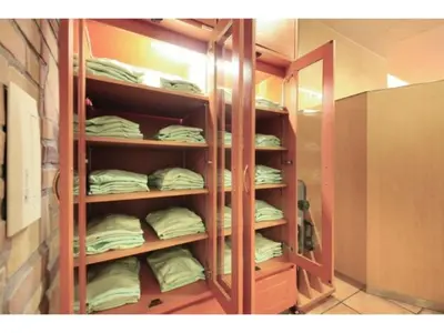 a room with a closet filled with lots of mattresses at R&B HOTEL HIGASHI NIHONBASHI - Vacation STAY 14017v in Tokyo