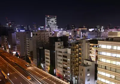 a view of a city at night with buildings at APA Hotel Ueno Ekimae in Tokyo