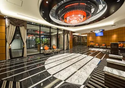 a lobby of a hotel with a large ceiling at APA Hotel Ueno Ekimae in Tokyo