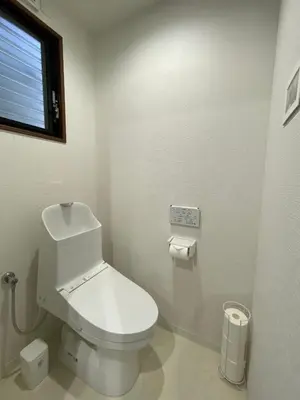 a white bathroom with a toilet and a window at Wonderful stay TOKYO nakanoshinbashi in Tokyo