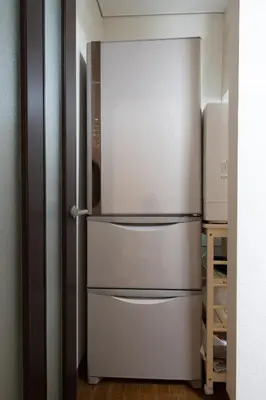 a stainless steel refrigerator in a kitchen at Annekaffeekanne in Tokyo