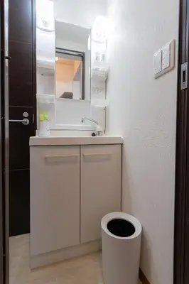 a bathroom with a sink and a toilet at Annekaffeekanne in Tokyo