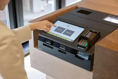 a person is pointing at a cash register at the b ginza in Tokyo