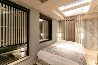 a bedroom with a bed and a large window at Hotel Karuta -Love hotel in Tokyo