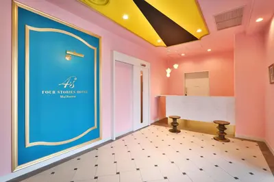 a room with pink and blue walls and a counter at Four Stories Hotel Maihama Tokyo Bay in Urayasu