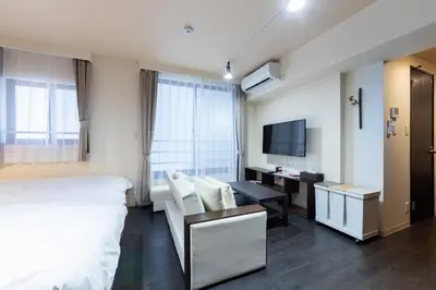 a hotel room with a bed and a desk and a tv at VACATION INN HEIWAJIMA 1 - Vacation STAY 10876 in Tokyo