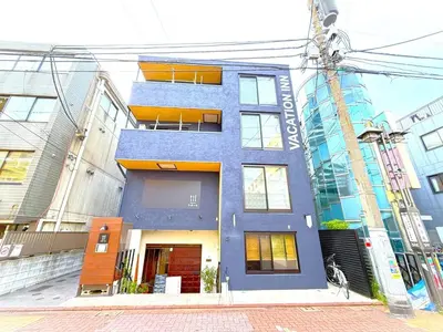 a blue building on the side of a street at VACATION INN HEIWAJIMA 1 - Vacation STAY 10876 in Tokyo