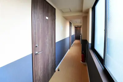 a hallway of an office building with a long corridor at Jing House akihabara Ryokan - Vacation STAY 30887v in Tokyo