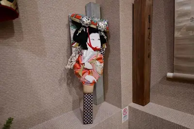 a doll hanging on the side of a wall at Jing House akihabara Ryokan - Vacation STAY 11566v in Tokyo