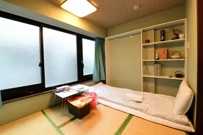 a room with a bed and a large window at Jing House akihabara Ryokan - Vacation STAY 11566v in Tokyo