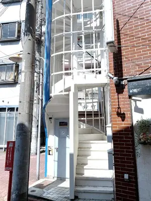 a white staircase leading up to a building at SKYE HOME in Tokyo