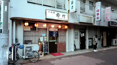 a person standing outside of a building at SKYE HOME in Tokyo