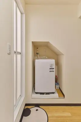 a white refrigerator in a room with a window at TORA HOTEL Tokyo Ueno \u5bc5\u30db\u30c6\u30eb \u4e0a\u91ce B in Tokyo