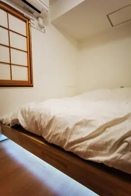 a white bed in a room with a window at belle via tokyo - Vacation STAY 32426v in Tokyo