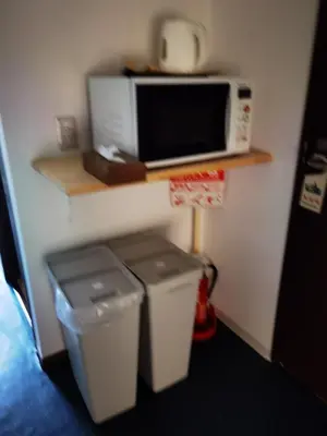 a kitchen with two trash cans and a microwave at belle via tokyo - Vacation STAY 32426v in Tokyo