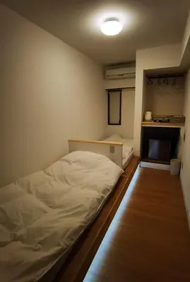 a small room with a bed and a tv at belle via tokyo - Vacation STAY 32425v in Tokyo