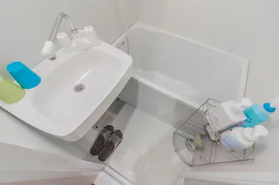 a bathroom with a white sink in a room at japan house Ikebukuro in Tokyo