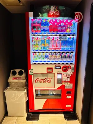 a red cocacola refrigerator with drinks in it at LOF HOTEL Shimbashi in Tokyo