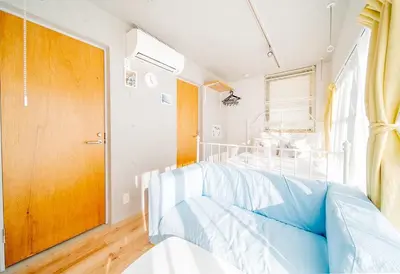 a bedroom with a bed and a window at japan house ebisu in Tokyo