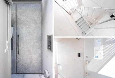 a staircase leading to a door in a room at japan house ebisu in Tokyo