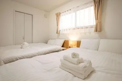 a room with two beds with towels on them at Noah Ikebukuro - Vacation STAY 11164 in Tokyo