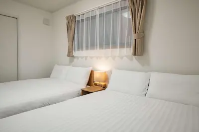 two beds sitting next to each other in a room at Noah Ikebukuro - Vacation STAY 11164 in Tokyo