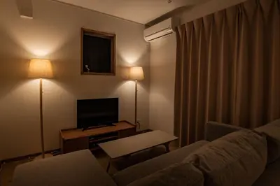 a living room with a couch and a flat screen tv at Noah Ikebukuro - Vacation STAY 11164 in Tokyo