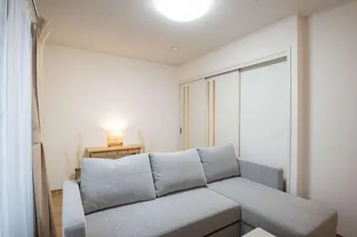 a living room with a couch and a window at Noah Ikebukuro - Vacation STAY 11164 in Tokyo