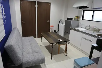 a small living room with a table and a couch at Wonderful stay TOKYO - Vacation STAY 30862v in Tokyo