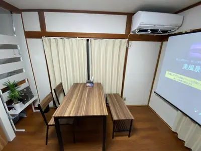 a meeting room with a table and a projection screen at wonderful stay TOKYO Daitabashi - Vacation STAY 31675v in Tokyo